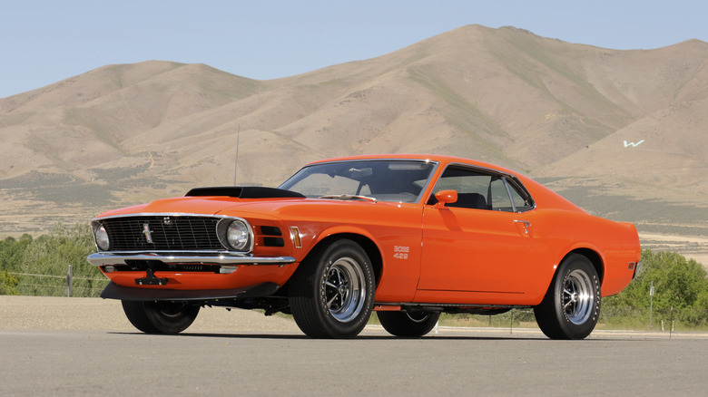An orange 1970 Ford Mustang Boss 429 parked