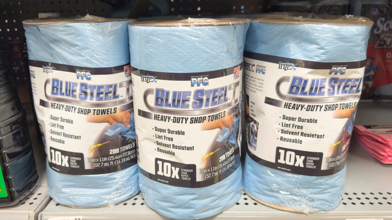 Blue heavy duty shop papertowels on a shelf in a store