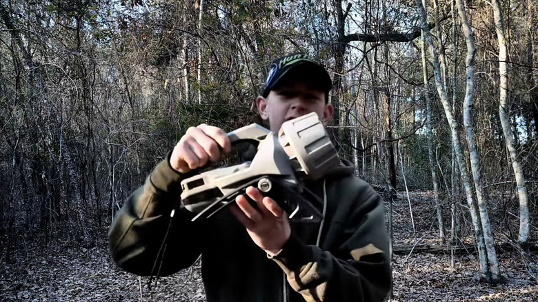 person holding electronic call tool