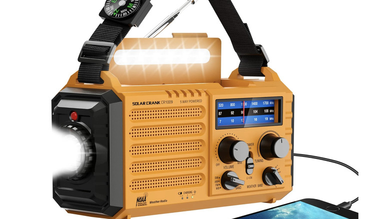 Exosmile portable emergency radio with an attached charging smartphone