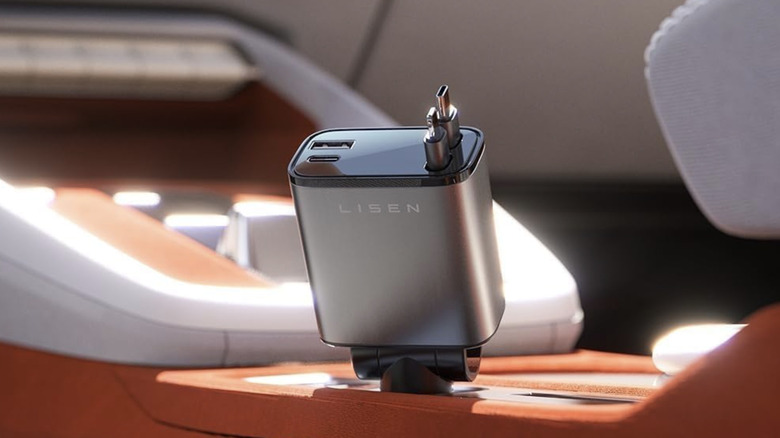Lisen retractable car charger placed at the center of a red and white car interior