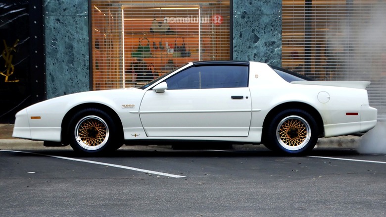 a white Pontiac Firebird 20th Anniversary Turbo Trans Am