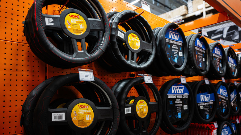 A wall display of steering wheel covers