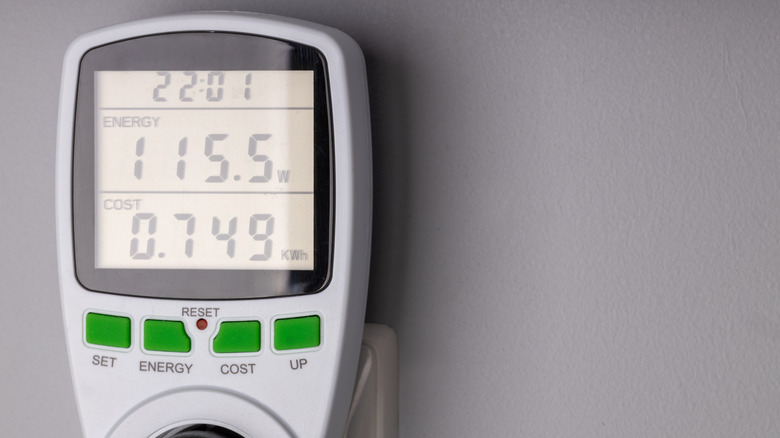 Digital device showing energy consumption and cost per KWh