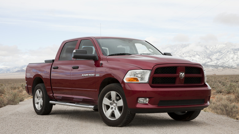A red Ram 1500 on a road..