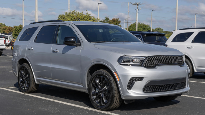 A silver Dodge Durango in a parking lot.