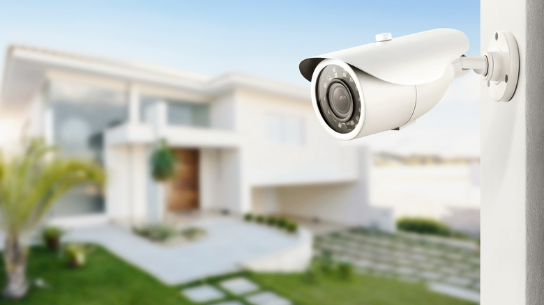 a closeup of a security camera on house