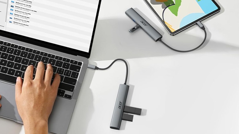 Acer USB-C hub plugged into laptop and tablet