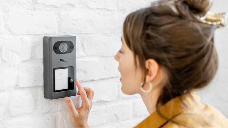 woman talking to intercom
