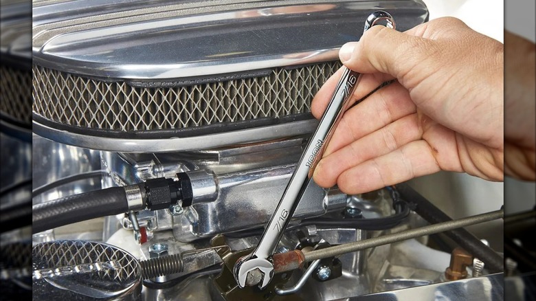 Icon Anti-Slip Grip Professional Metric Combination Wrench in use on a throttle linkage