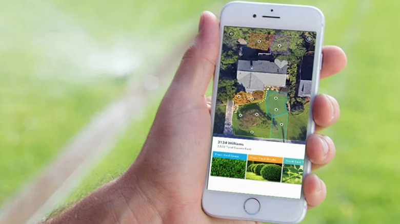 Rachio 3 WiFi smart sprinkler controller interface on smartphone with sprinkers running