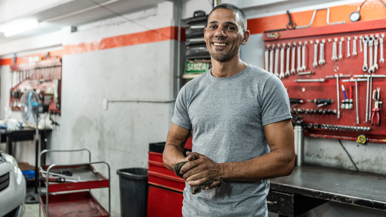 Person smiling in their garage
