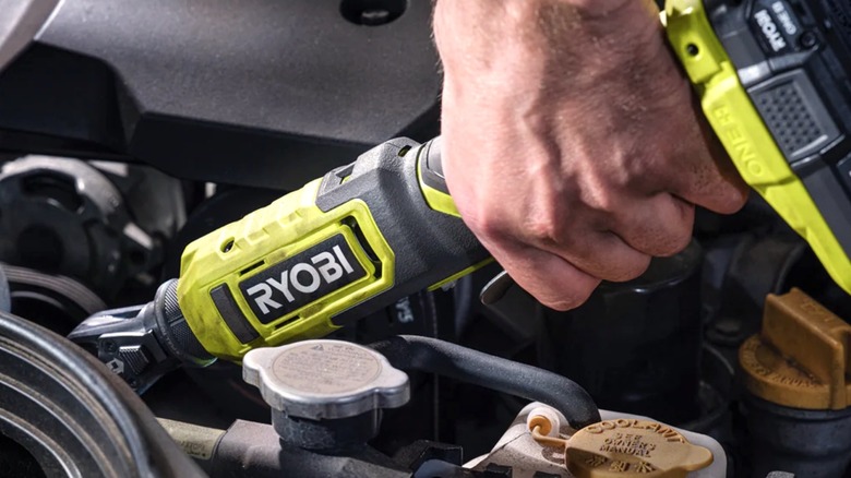 Person using Ryobi 18V ratchet