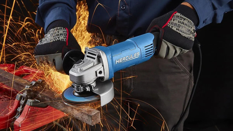 Hercules angle grinder held against square metal rod with sparks flying