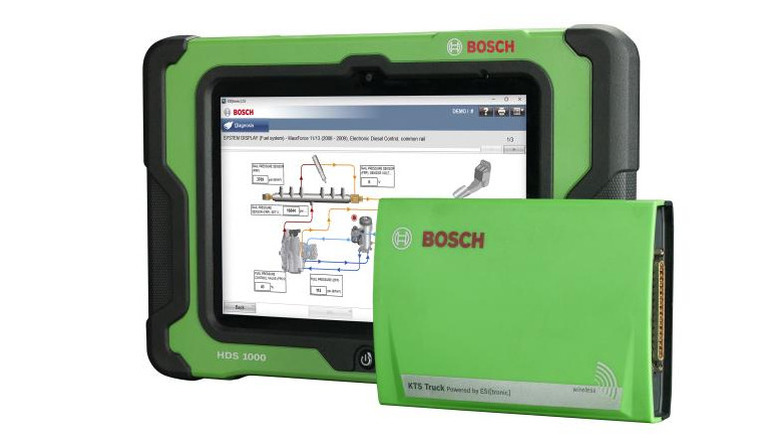 Green and black tablet with a diagnostics display, on a white background