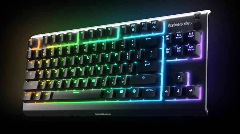 Dramatic glowing steelseries keyboard on black background