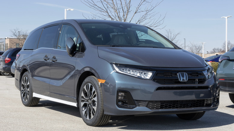 Honda Odyssey family marked parked outdoors.