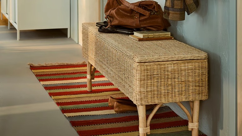 the Tolkning bench with storage placed near a bicycle