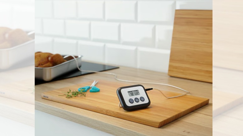 the FANTAST meat thermometer and timer on a cutting board