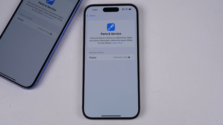 iPhone on table with unknown part warning on screen