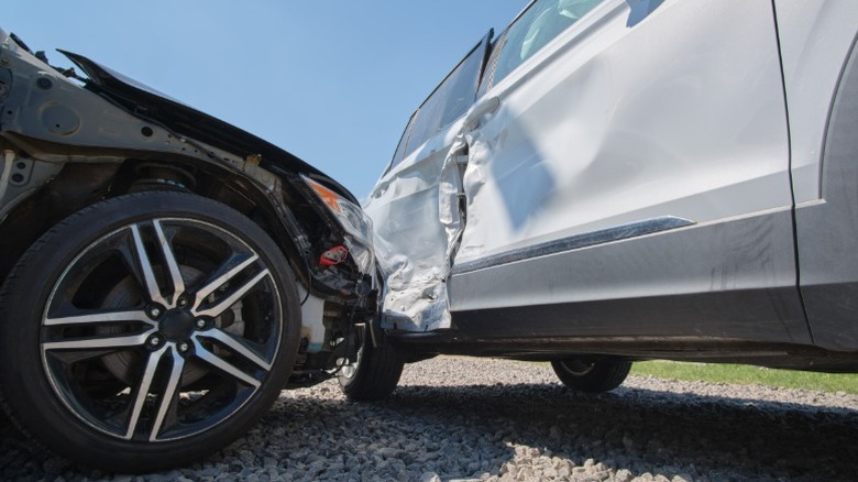 A car runs into the rear of another car on the road
