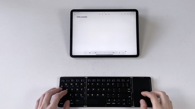 Close up of a keyboard and iPad
