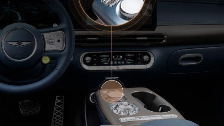 Dashboard highlighting a feature on a round gear shifter