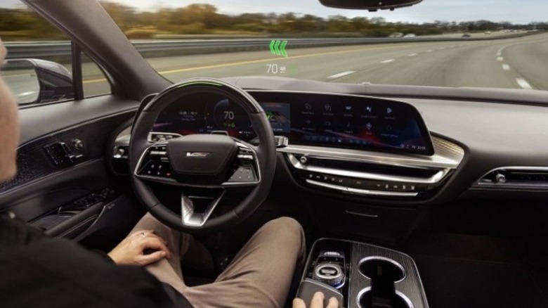 Person driving on a highway looking through a heads up display