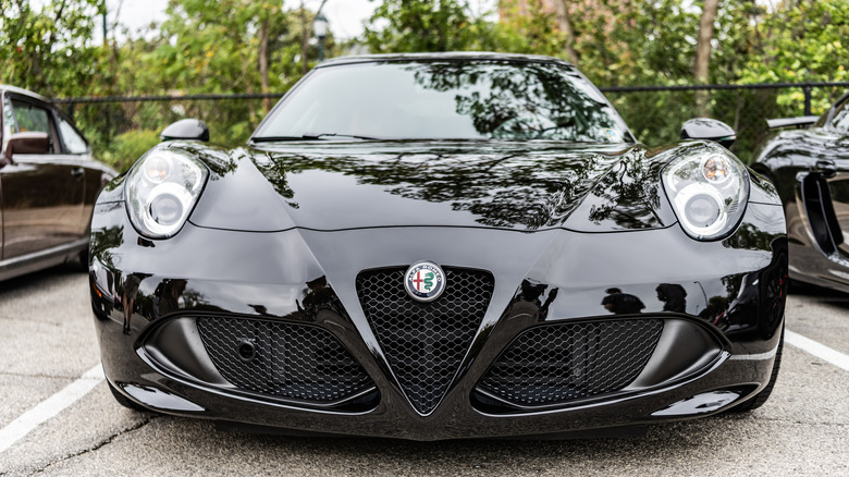 Front view of a shiny black luxury car