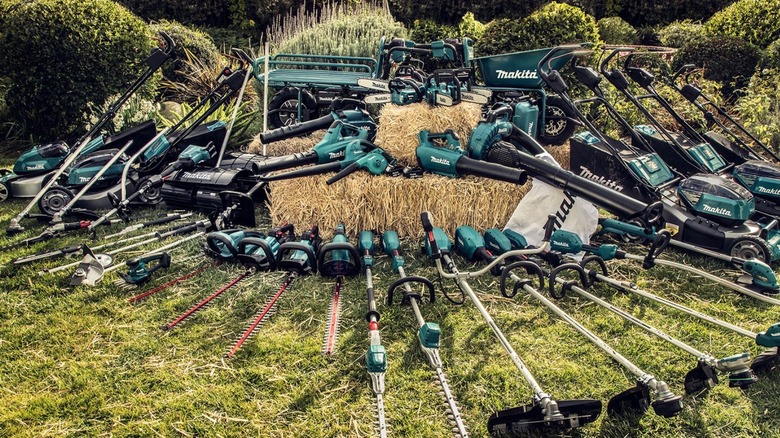 Makita tools sitting on grass