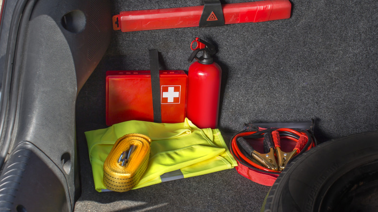 Emergency kit in vehicle trunk