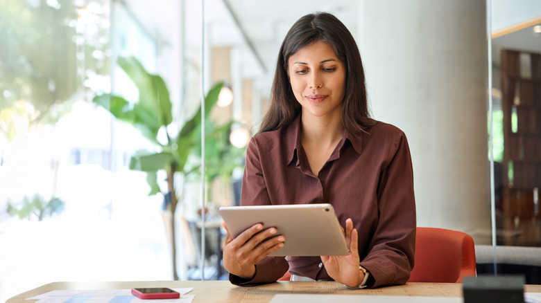 Woman operatres tablet