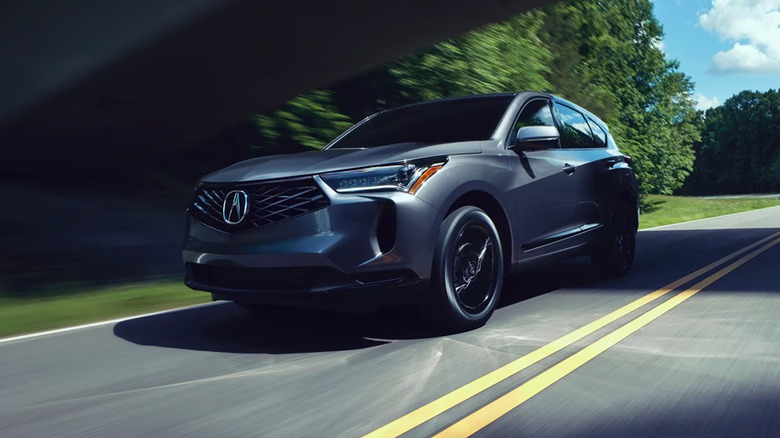 A gray 2025 Acura RDX driving