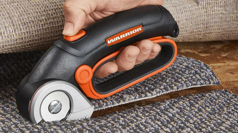 The Warrior Power Cutter being used to cut a carpet