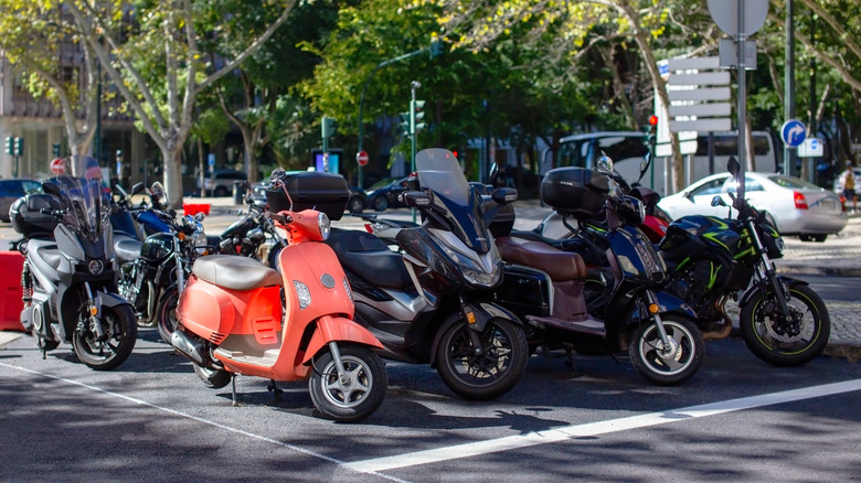 Motorcycles next to each other in a parking lot