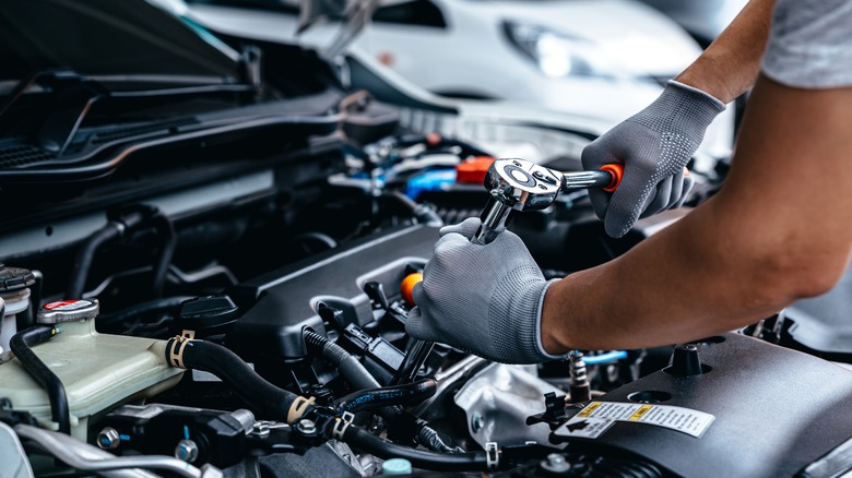 person repairing car
