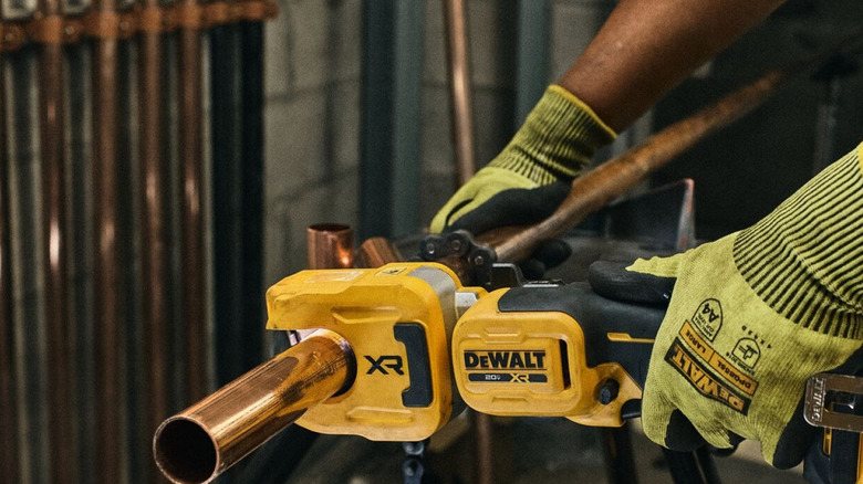 Man uses DeWalt 20V Max XR 1-1/4 Inch Copper Tubing Cutter