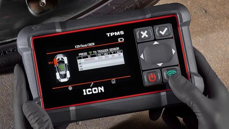 Person using an Icon Professional Tire Pressure Monitoring System
