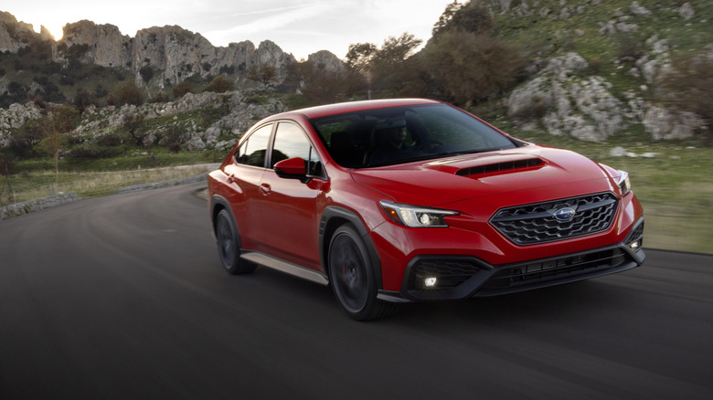 Red Subaru WRX on mountain road