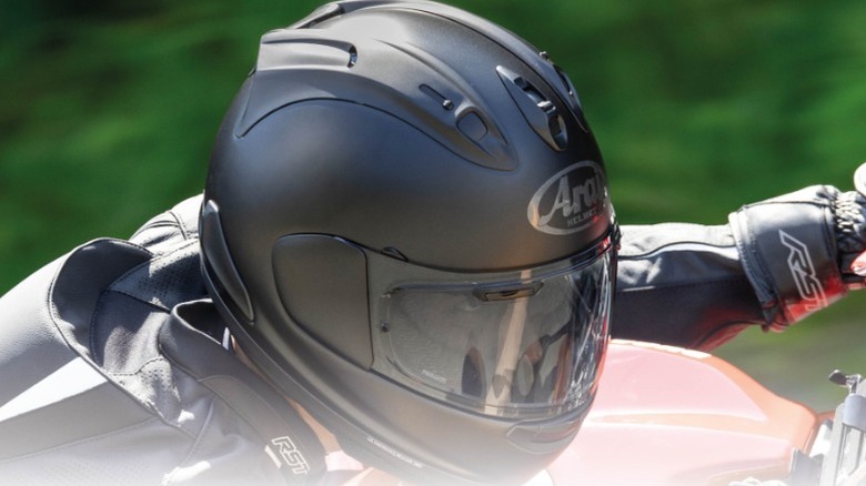 Motorcyclist wearing Arai helmet