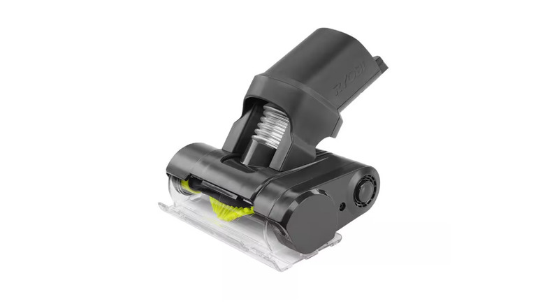 A black and green motorized beater bar on a white background.
