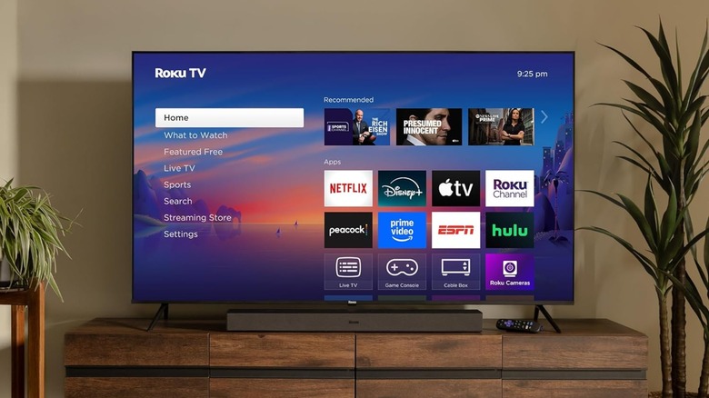 A Roku Select TV in room, on a TV stand.