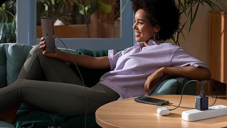 woman charging multiple devices