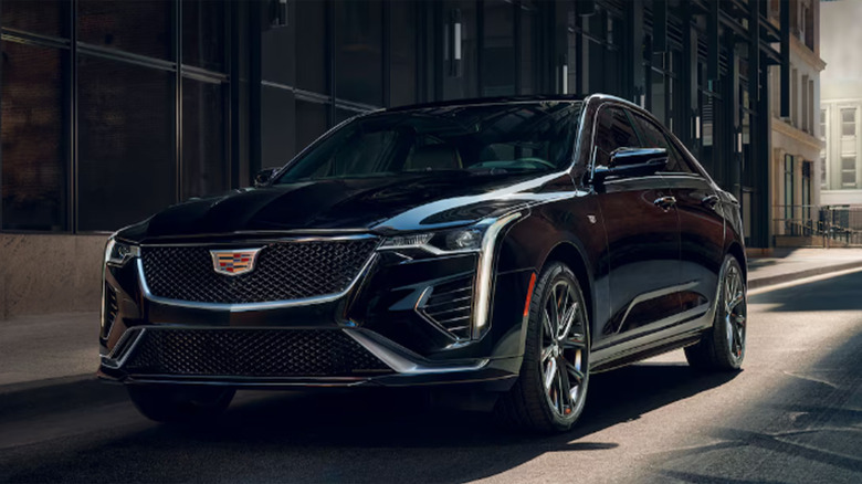 A black Cadillac CT4 parked on a city street