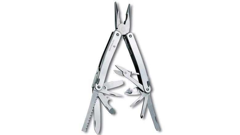 Silver Victorinox SwissTool Spirit X with pliers out, tools exposed, on a white background