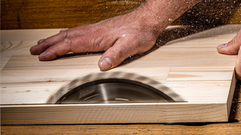 wood being cut table saw