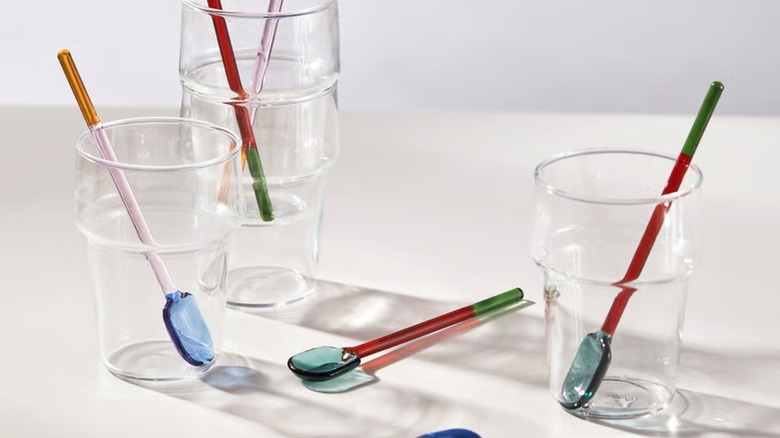 Fengomarre spoons sitting inside of glassware