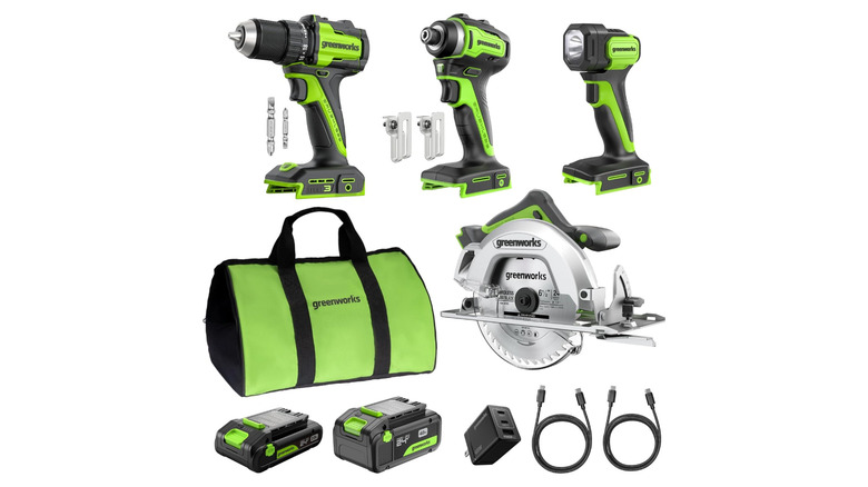 Green and black power tools, batteries, and bag