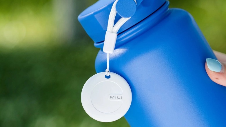 Mili tag tracker on a blue water bottle