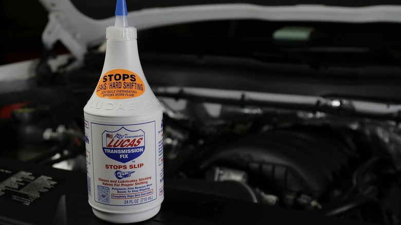 Lucas Oil Transmission Fix bottle on a car